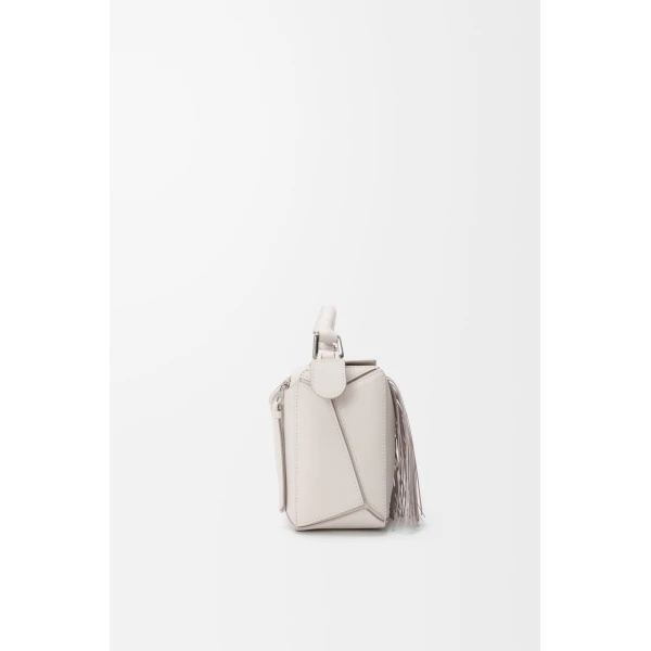 Loewe Fringe small Puzzle bag in classic calfskin, Soft White/Light Ghost | Shoulder & Crossbody Bags | Coveti