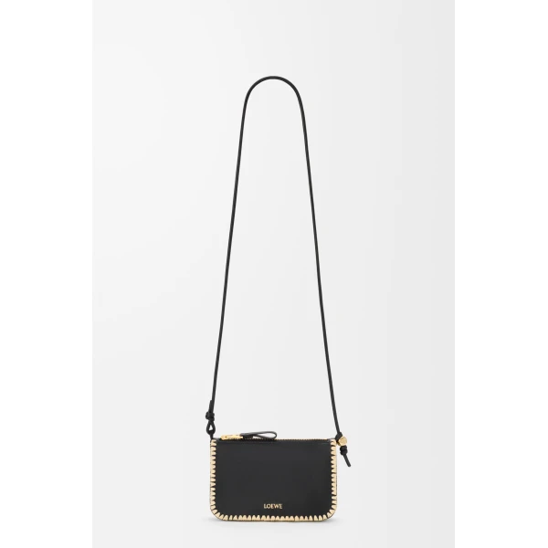 Loewe Rio pouch in classic calfskin and raffia, Black | Clutch Bags | Coveti