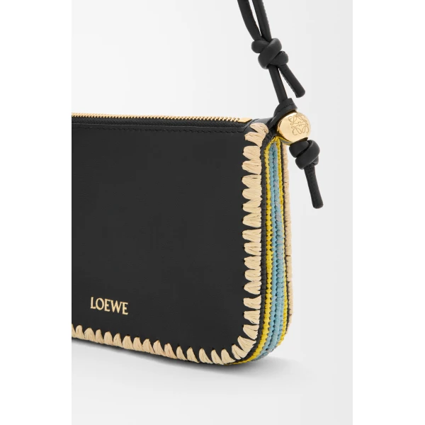 Loewe Rio pouch in classic calfskin and raffia, Black | Clutch Bags | Coveti