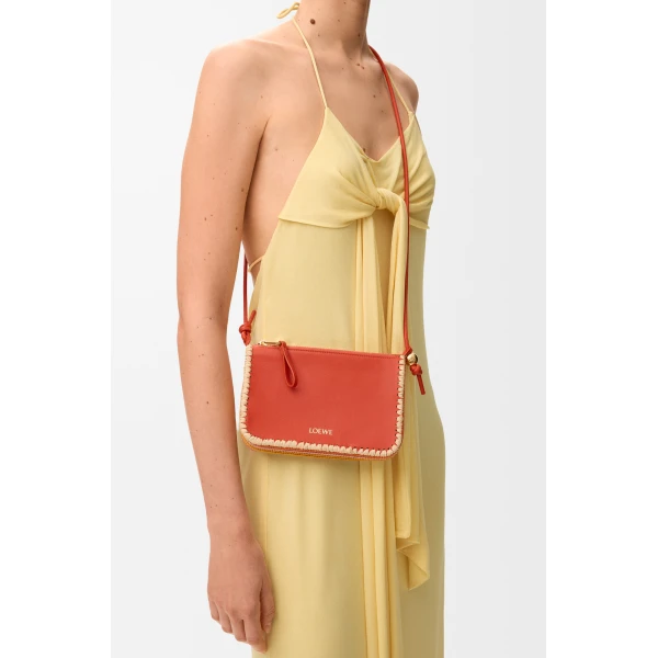 Loewe Rio pouch in classic calfskin and raffia, Deep Saffron | Clutch Bags | Coveti