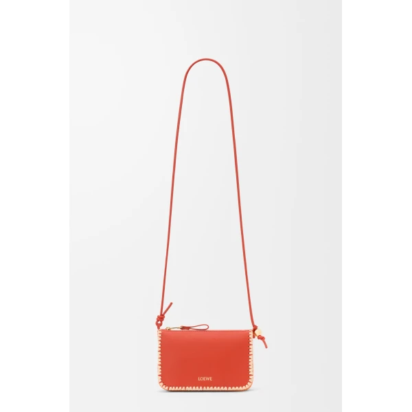 Loewe Rio pouch in classic calfskin and raffia, Deep Saffron | Clutch Bags | Coveti