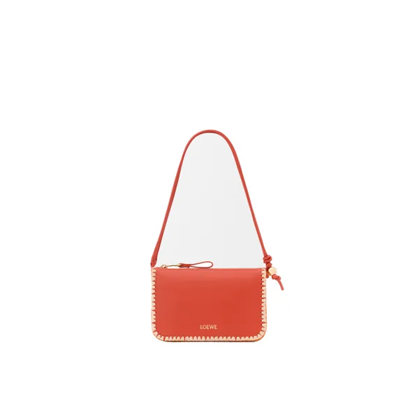 Loewe Rio pouch in classic calfskin and raffia, Deep Saffron | Clutch Bags | Coveti
