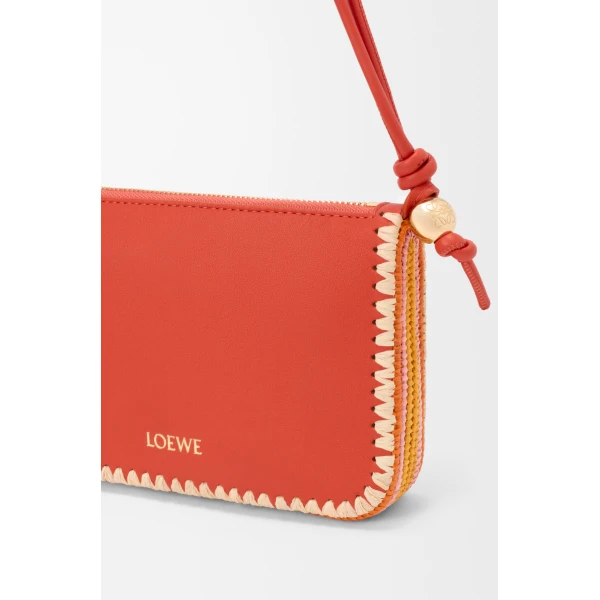 Loewe Rio pouch in classic calfskin and raffia, Deep Saffron | Clutch Bags | Coveti