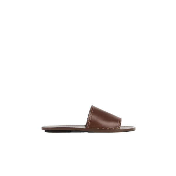 Toteme Studded leather slides in Sienna