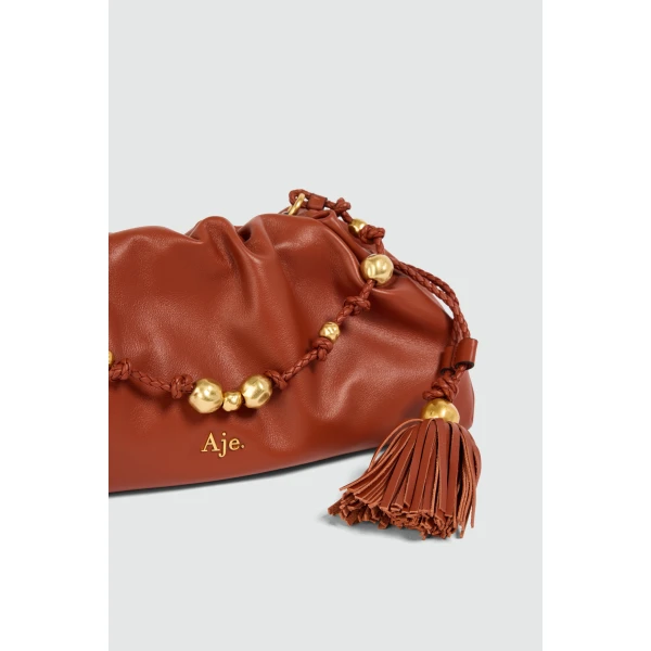 Aje Amber Clutch in Chestnut | Clutch Bags | Coveti