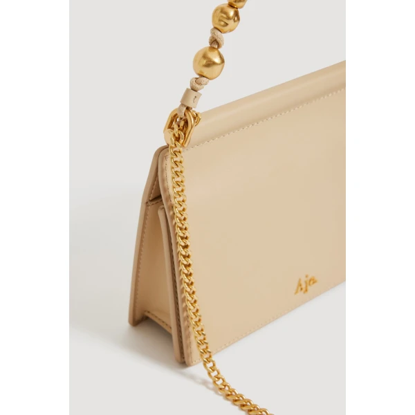 Aje Cece Clutch in Beach Beige | Clutch Bags | Coveti