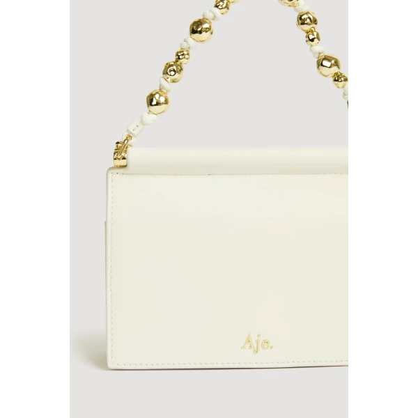 Aje Cece Clutch in Ivory | Clutch Bags | Coveti