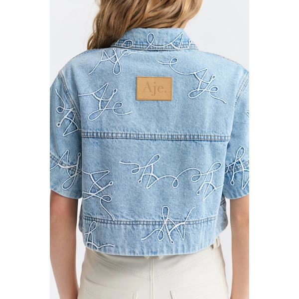 Aje Coast Logo Denim Shirt in Light Wash Blue | Shirts | Coveti