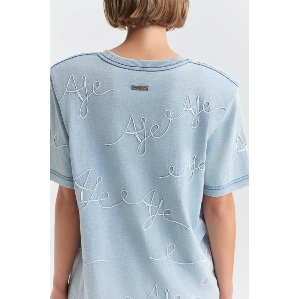 Aje Coast Logo Denim Wash Tee in Light Wash Blue | T-shirts | Coveti
