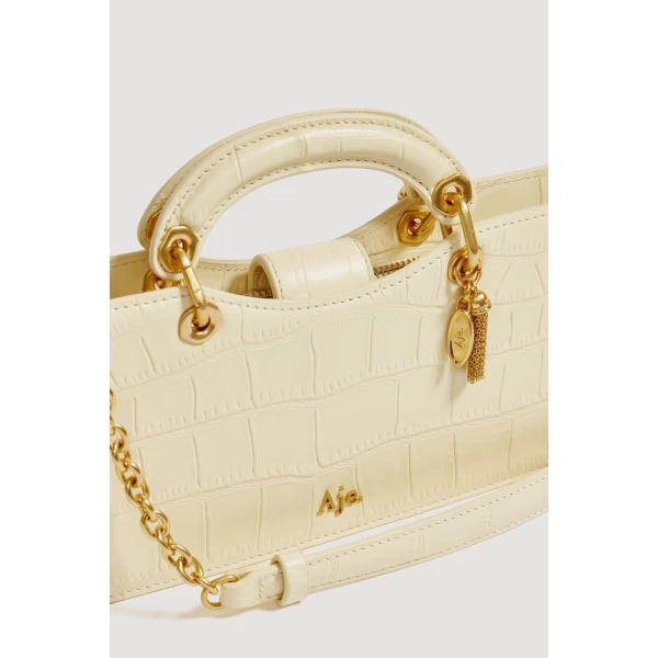 Aje Corrie Small Clutch in Ivory Croc | Clutch Bags | Coveti