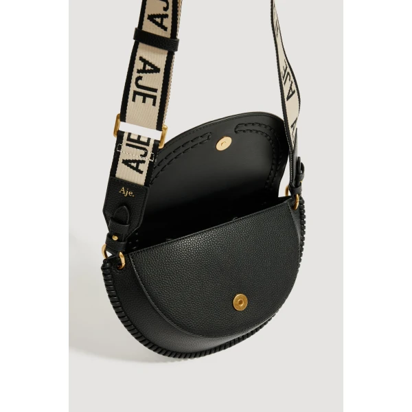 Aje Emery Medium Saddle Bag in Black | Shoulder & Crossbody Bags | Coveti