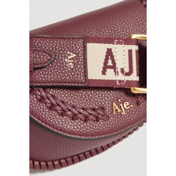Aje Emery Small Saddle Bag in Mulberry | Shoulder & Crossbody Bags | Coveti