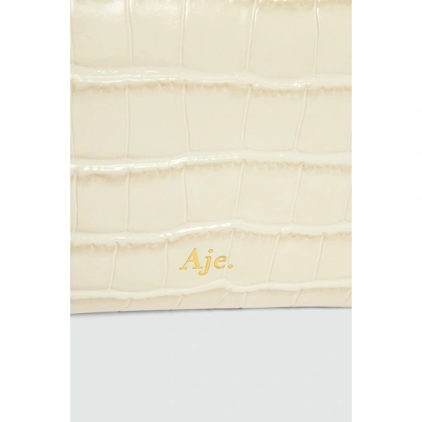 Aje Luna Long Clutch in Ivory Croc | Clutch Bags | Coveti