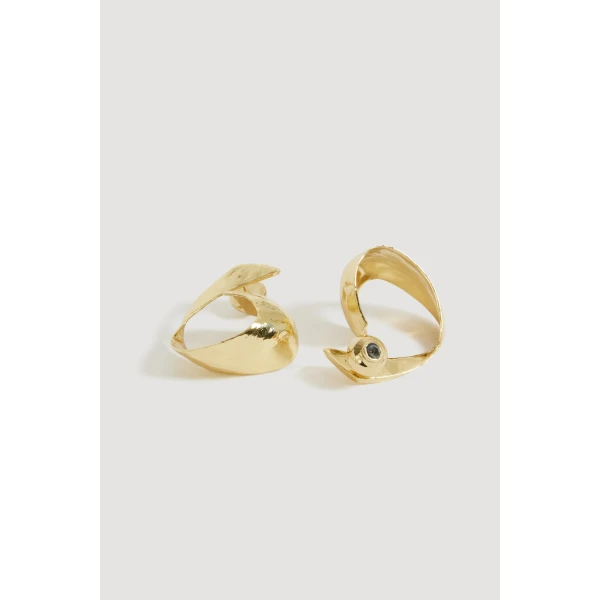 Aje Melody Ribbon Earring in Gold | Earrings | Coveti