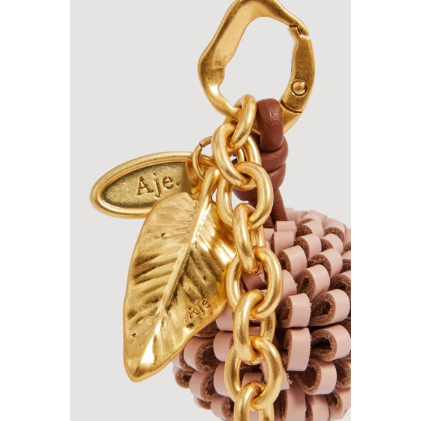 Aje Mini Pompom Charm in Fawn Pink | Bag charms | Coveti