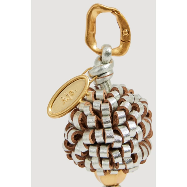 Aje Mini Pompom Charm in Silver | Bag charms | Coveti