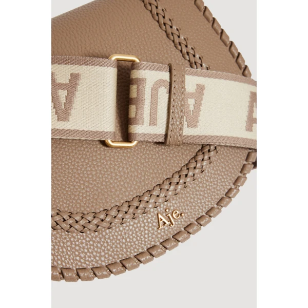 Aje Nina Logo Crossbody in Taupe | Shoulder & Crossbody Bags | Coveti