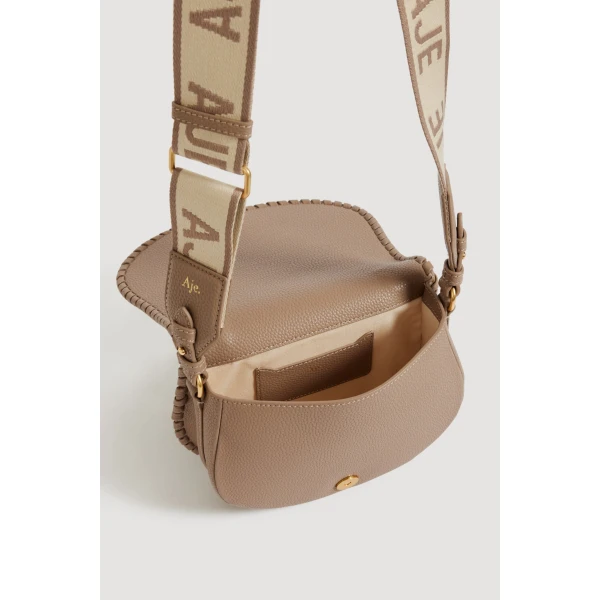 Aje Nina Logo Crossbody in Taupe | Shoulder & Crossbody Bags | Coveti