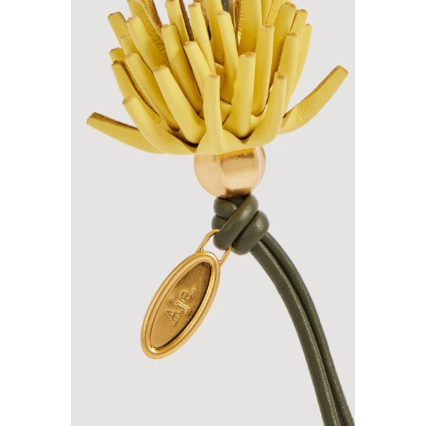 Aje Protea Flower Charm in Pine-Golden Ochre | Bag charms | Coveti