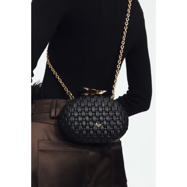 Aje Retrofete Woven Clutch in Black | Clutch Bags | Coveti