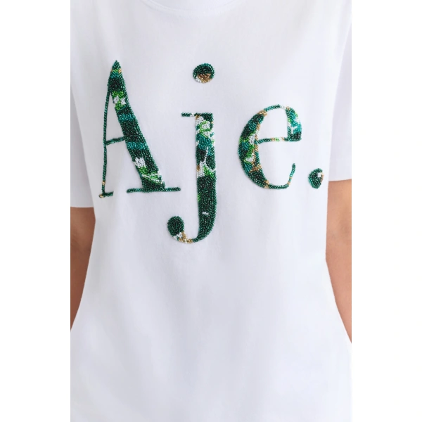 Aje Solana Embellished Logo Tee in White/Emerald | T-shirts | Coveti