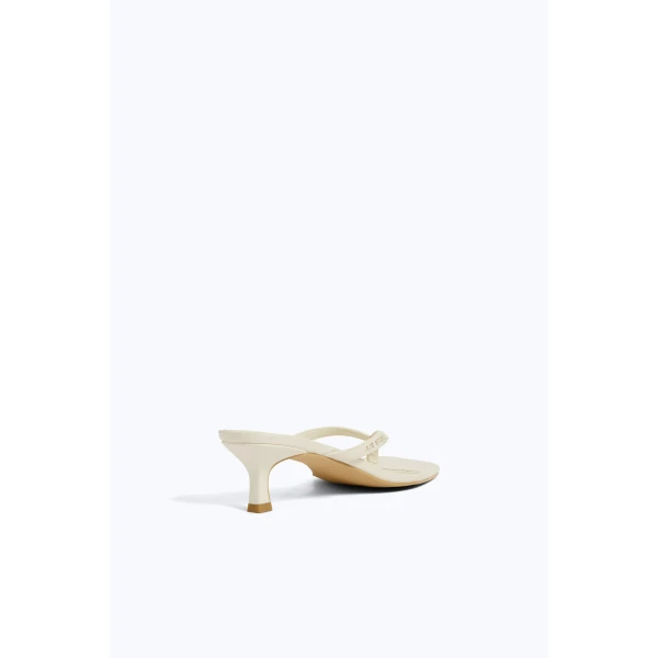 Aje Studio Thong Heel in Ivory | Heels | Coveti