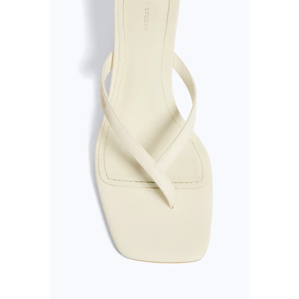 Aje Studio Thong Heel in Ivory | Heels | Coveti