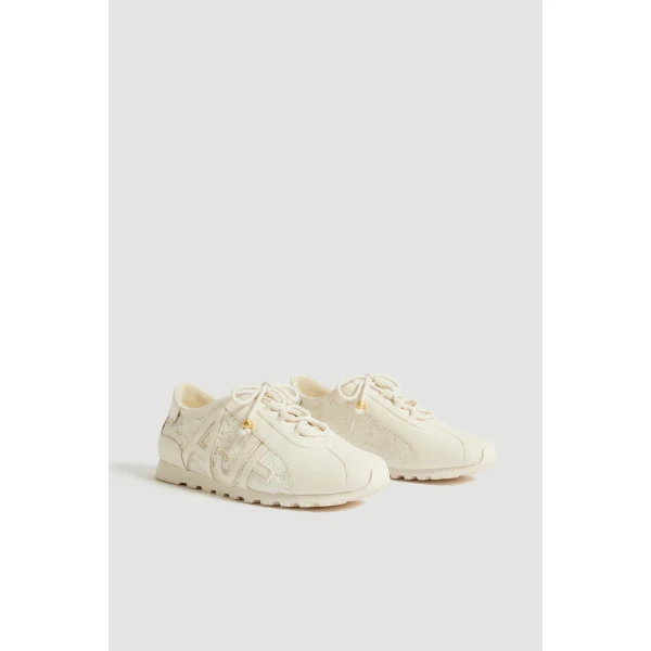 Aje Valli Lace Logo Trainer in Ivory Velvetine | Sneakers | Coveti