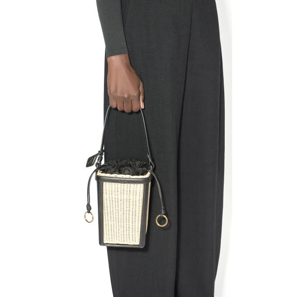 Alaia Bucket Small Bag in Wicker, Black | Bucket Bags | Coveti