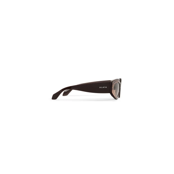Alaia Cat Eye Sunglasses in Transparent Brown | Sunglasses | Coveti