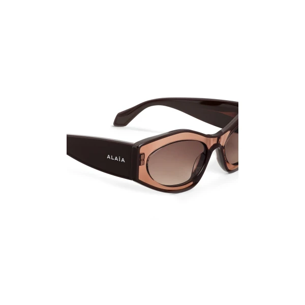 Alaia Cat Eye Sunglasses in Transparent Brown | Sunglasses | Coveti