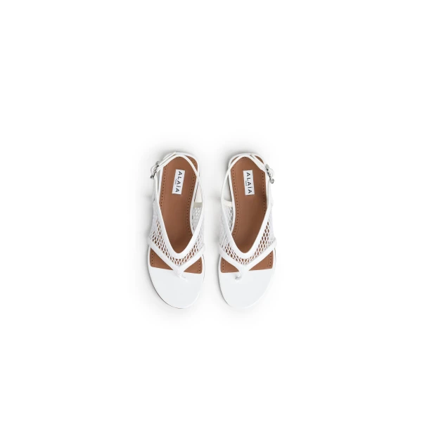 Alaia Fishnet Thong Sandals in Patent Calfskin, Optical White | Sandals | Coveti