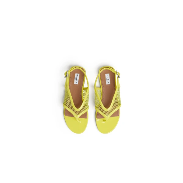 Alaia Fishnet Thong Sandals in Patent, Lemon Yellow | Sandals | Coveti