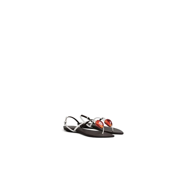 Alaia Flat Jewel Sandals in Patent Leather, Optical White | Sandals | Coveti