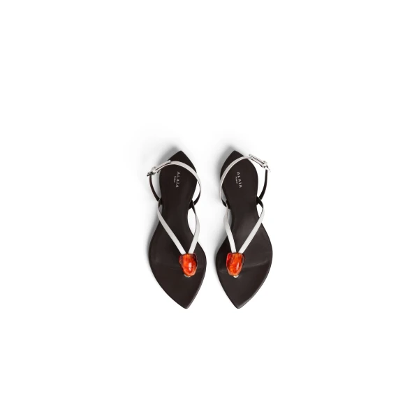 Alaia Flat Jewel Sandals in Patent Leather, Optical White | Sandals | Coveti