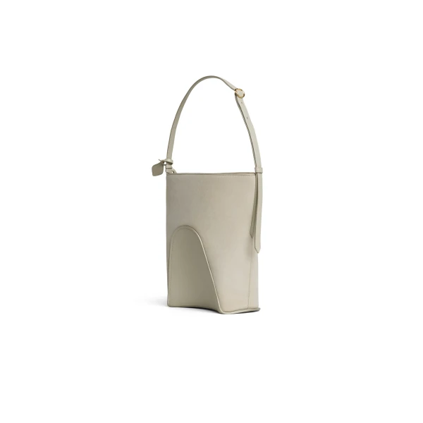 Alaia Hip Small Bucket Bi-Material Bag in Leather, Beige Grey | Bucket Bags | Coveti
