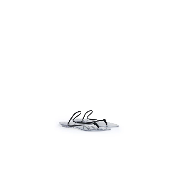 Alaia Invisible Thong in Patent Leather, Black | Sandals | Coveti