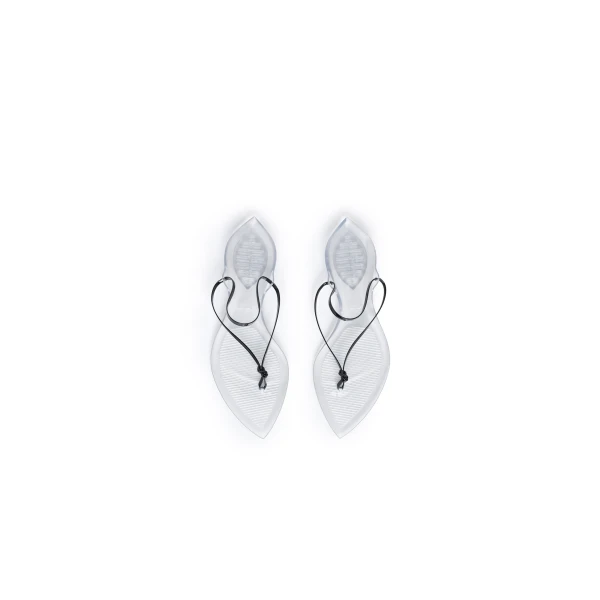 Alaia Invisible Thong in Patent Leather, Black | Sandals | Coveti