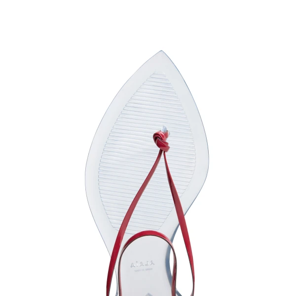 Alaia Invisible Thong in Patent Leather, Carmine | Sandals | Coveti