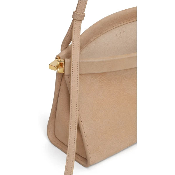 Alaia Le Click East West Medium Bag in Nubuck, Desert | Shoulder & Crossbody Bags | Coveti