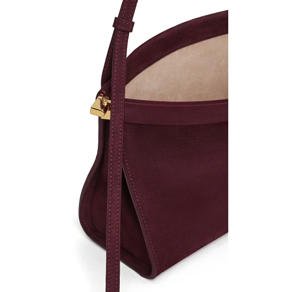 Alaia Le Click East West Medium Bag in Nubuck, Garnet Red | Shoulder & Crossbody Bags | Coveti