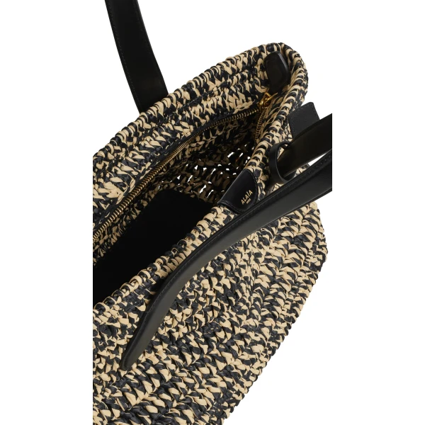 Alaia Le Panier East West Medium Bag in Raffia, Natural and Black | Totes & Top-Handle Bags | Coveti