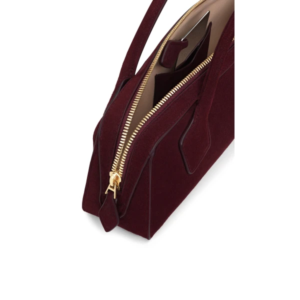 Alaia Le Teckel Clutch in Suede, Garnet Red | Clutch Bags | Coveti