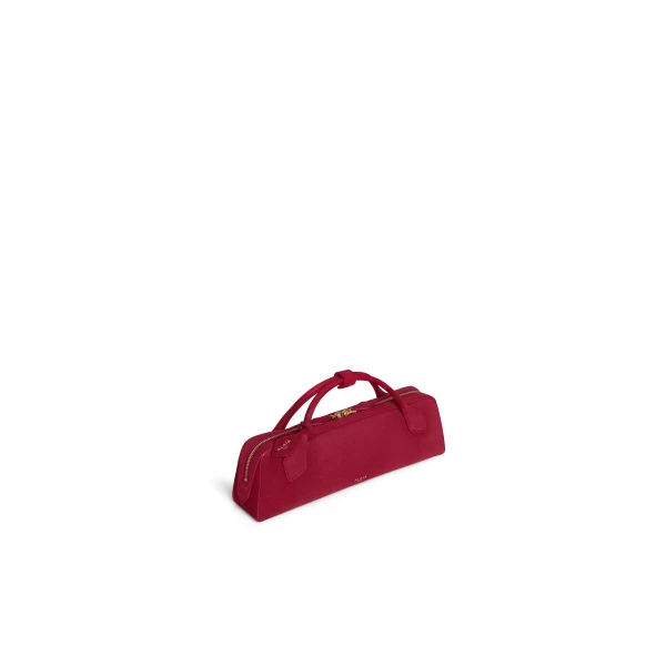 Alaia Le Teckel Clutch in Suede, Raspberry | Clutch Bags | Coveti