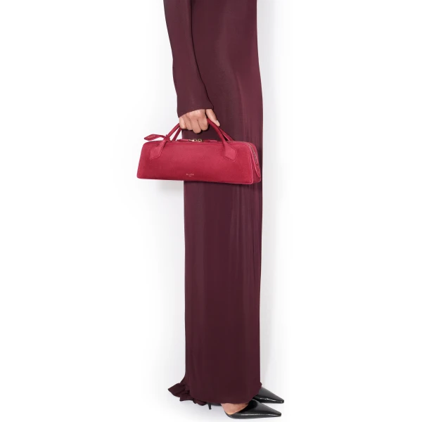 Alaia Le Teckel Clutch in Suede, Raspberry | Clutch Bags | Coveti