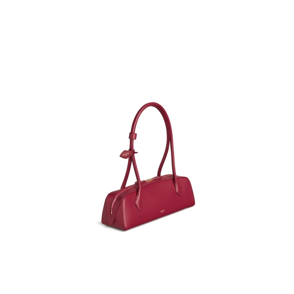 Alaia Le Teckel Medium Bag in Calfskin, Carmine | Shoulder & Crossbody Bags | Coveti