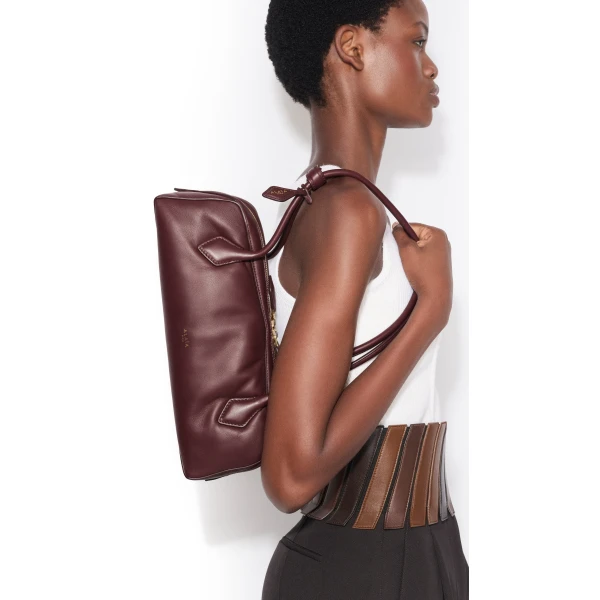 Alaia Le Teckel Medium Bag in Padded Leather, Garnet Red | Shoulder & Crossbody Bags | Coveti