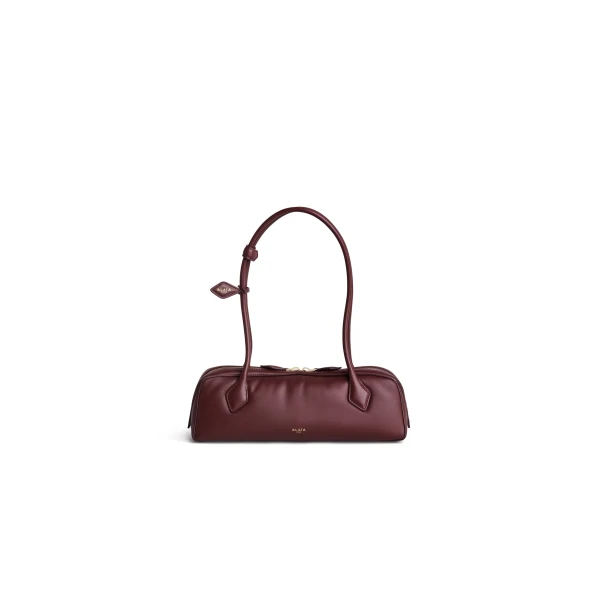 Alaia Le Teckel Medium Bag in Padded Leather, Garnet Red | Shoulder & Crossbody Bags | Coveti