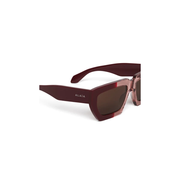 Alaia Melted Rectangular Sunglasses in Bordeaux | Sunglasses | Coveti