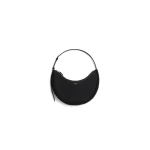 Alaia One Piece Demi Lune Bag in Merino Shearling, Black | Shoulder & Crossbody Bags | Coveti